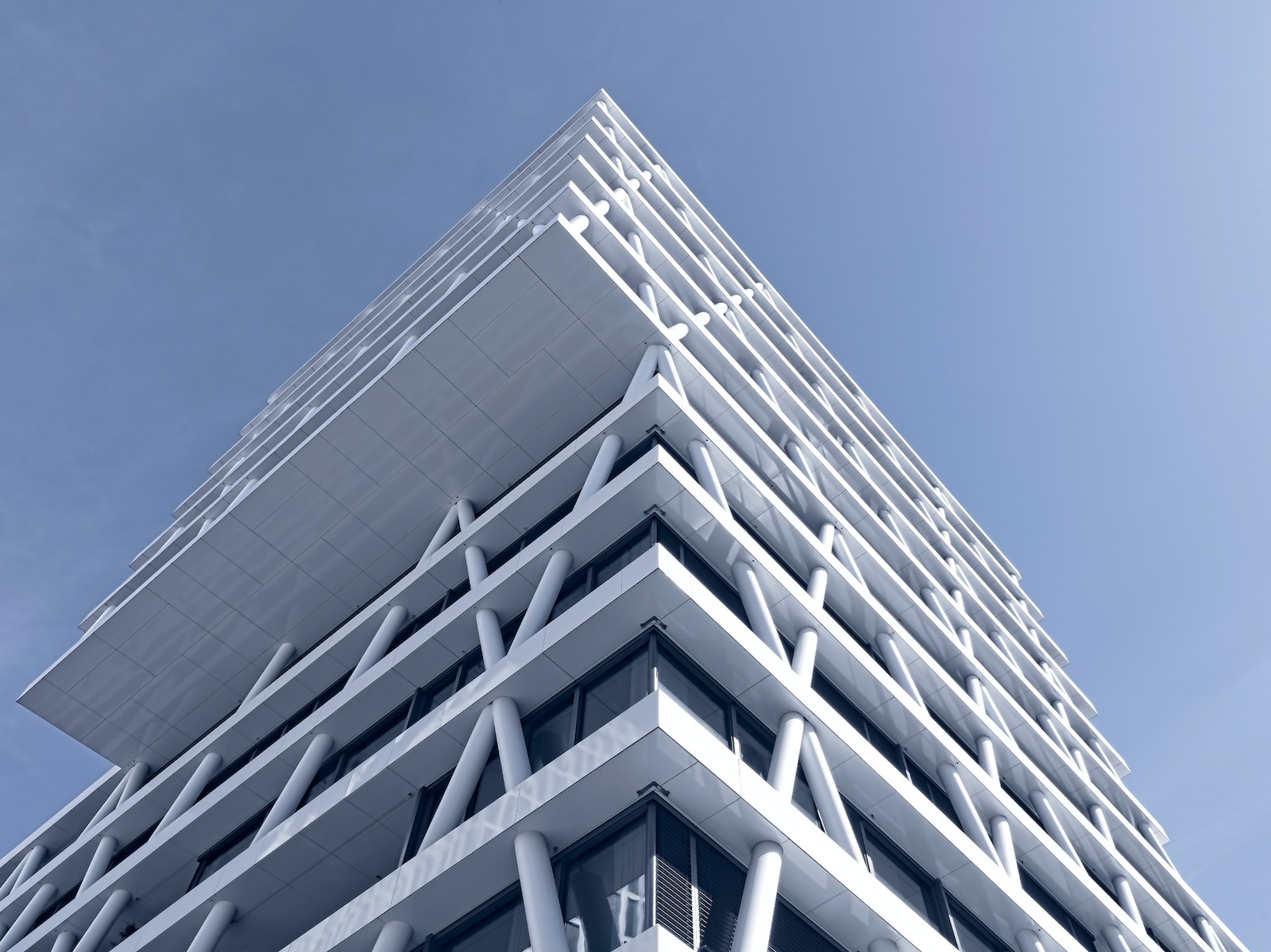 low-angle photo of white high-rise building